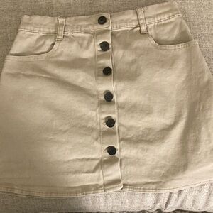 Tan skirt from brandy Melville with buttons.